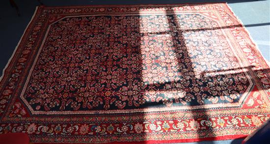 A Hamadan black ground small carpet 222 x 300cm